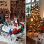 Wewnątrz znajduje się choinka z prezentami i zaśnieżona wioska zabawek z torem kolejowym.