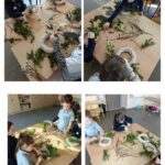 Czworo dzieci przy stolikach robi wieńce z zielonych gałęzi i gałązek w klasie.