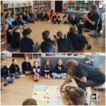 Dzieci siedzą w kręgu z nauczycielem, słuchając i uczestnicząc w zajęciach w klasie.